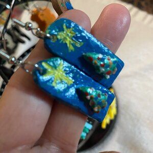 dangling clay handpainted earrings with christmas tree and star